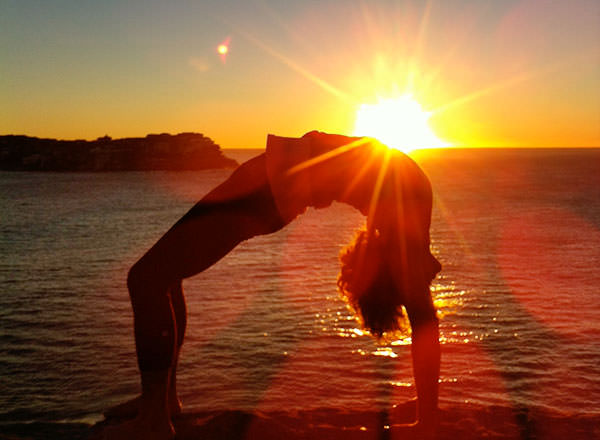 A sunrise yoga session before youron your Sydney Private Day Tour starts